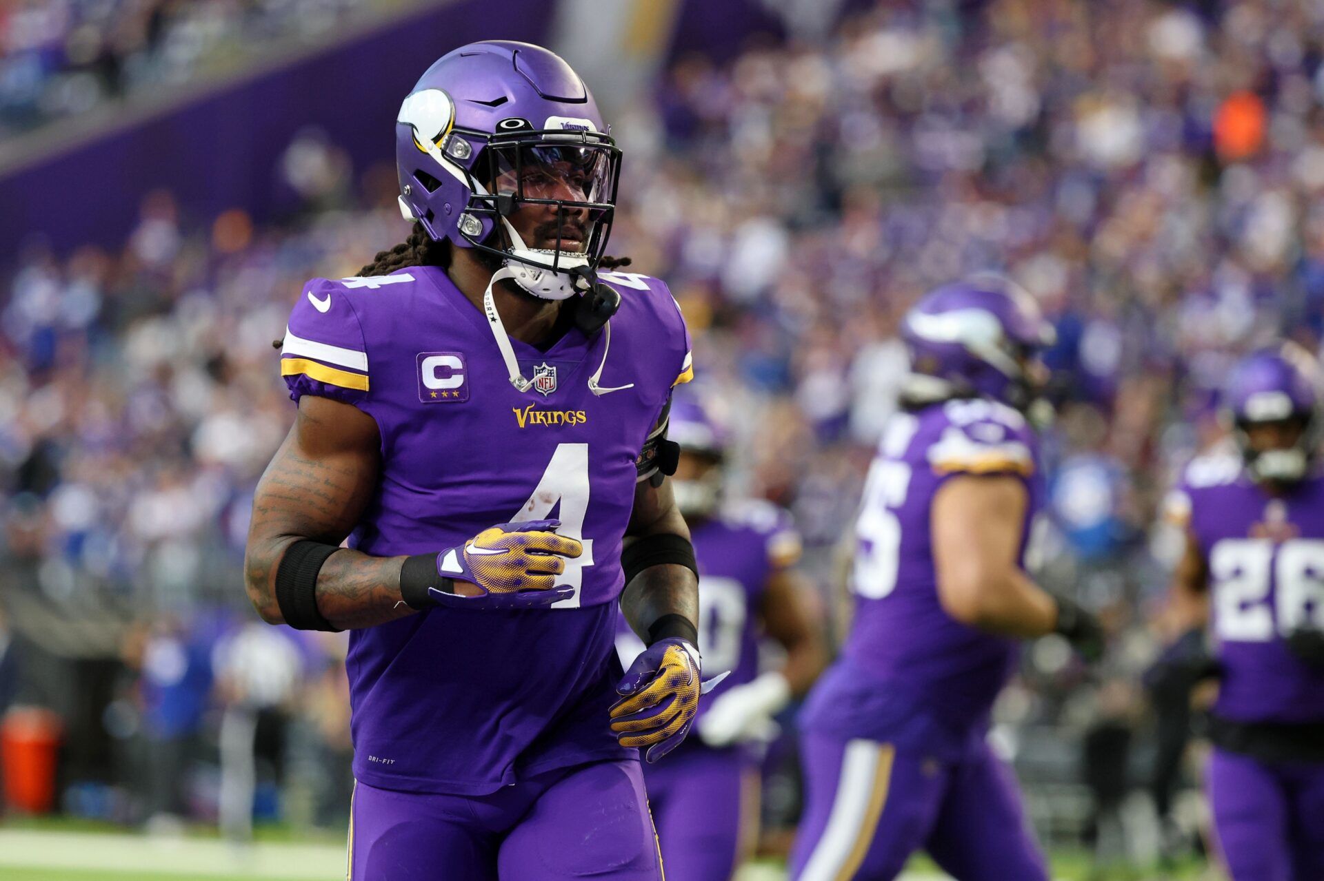 Dalvin Cook (4) runs on the field during warmups before a wild card game against the New York Giants at U.S. Bank Stadium.