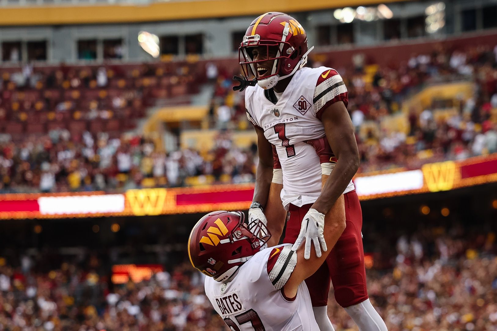 Jahan Dotson (1) celebrates with tight end John Bates (87) after catching the game winning touchdown against the Jacksonville Jaguars during the second half.