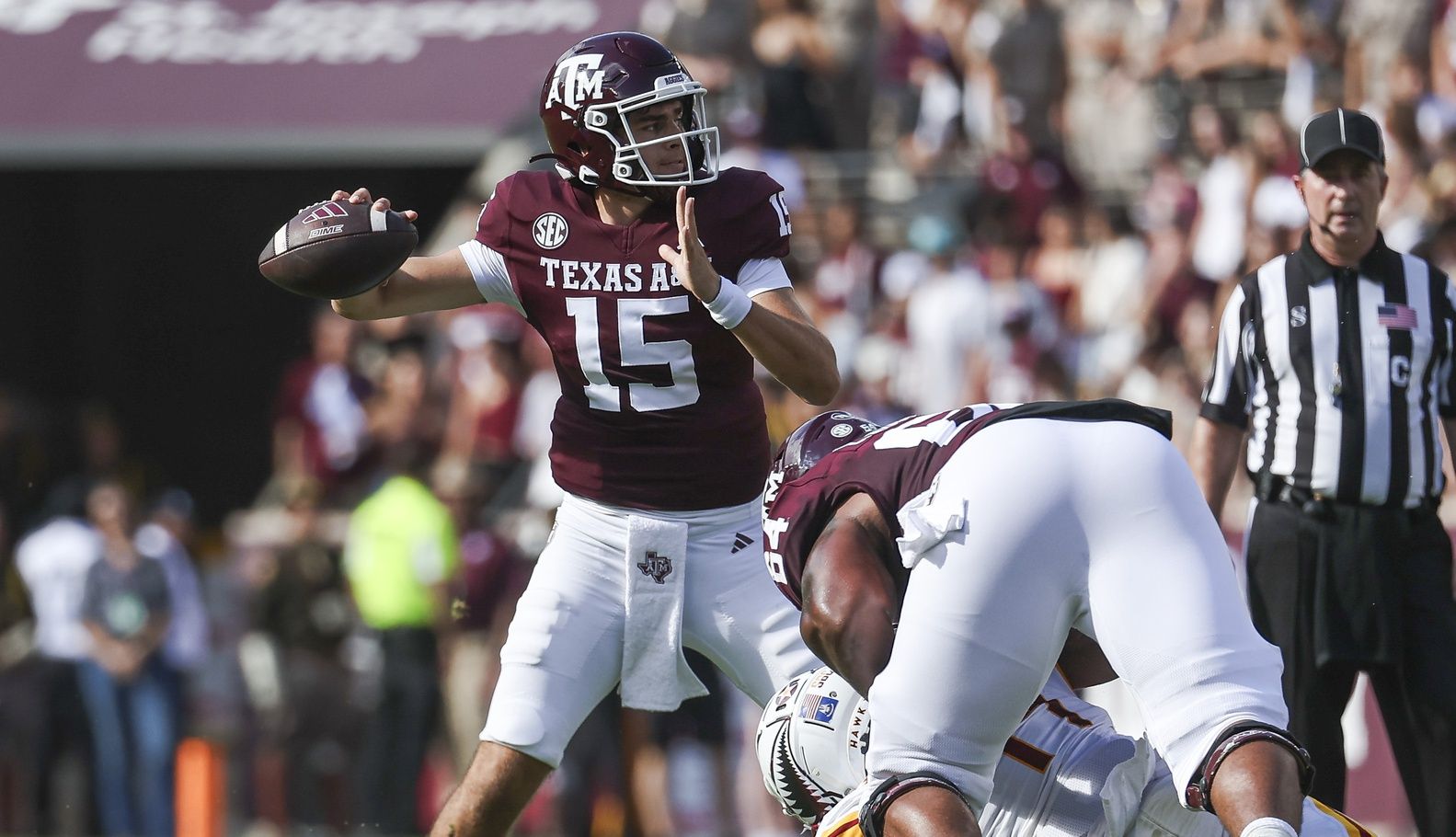 Conner Weigman (15) attempts a pass during the second quarter against the Louisiana Monroe Warhawks at Kyle Field.