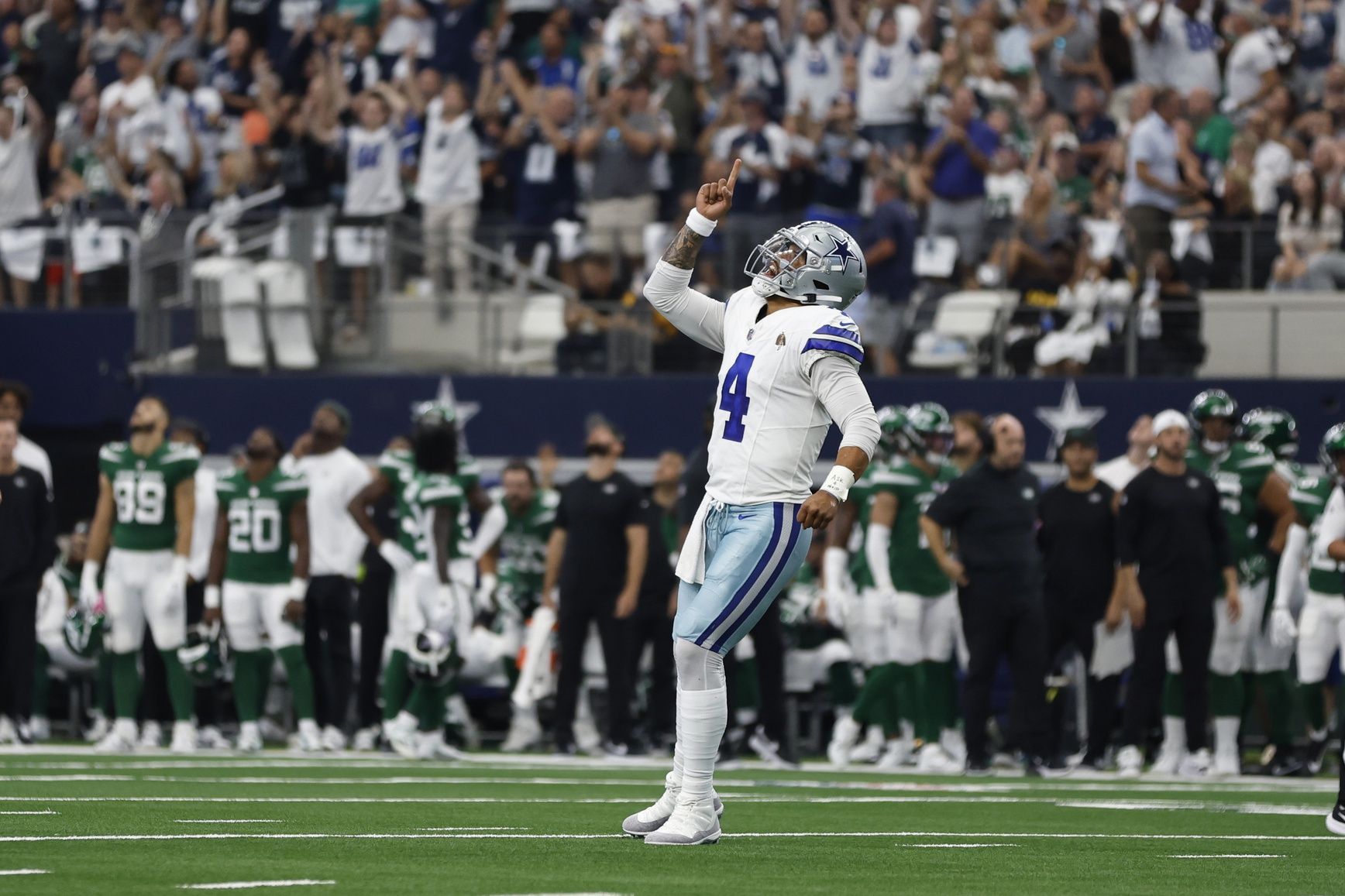 Dak Prescott (4) reacts after a touchdown in the first quarter against the New York Jets at AT&T Stadium.