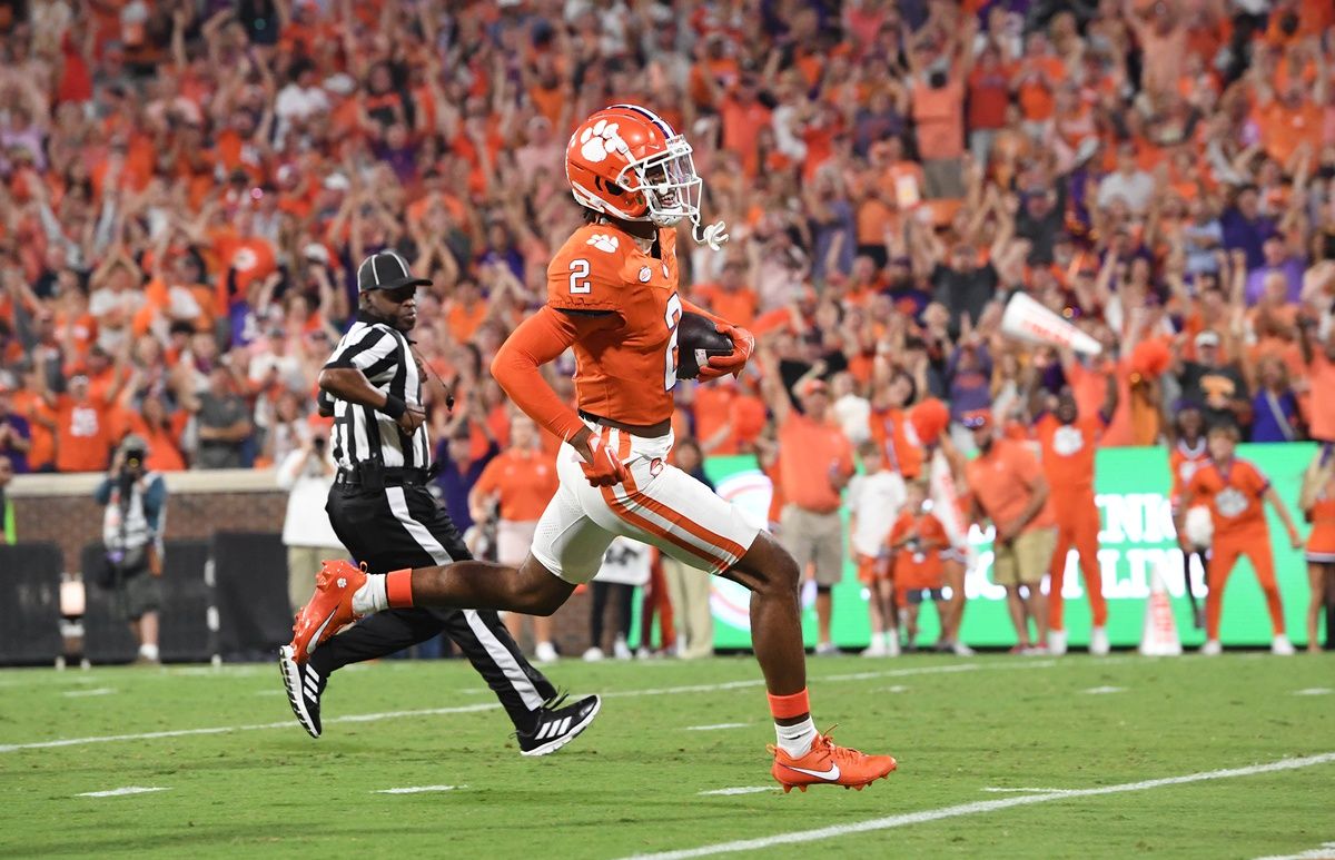 Nate Wiggins (2) returns an interception for a touchdown during the first quarter against Florida Atlantic at Memorial Stadium.