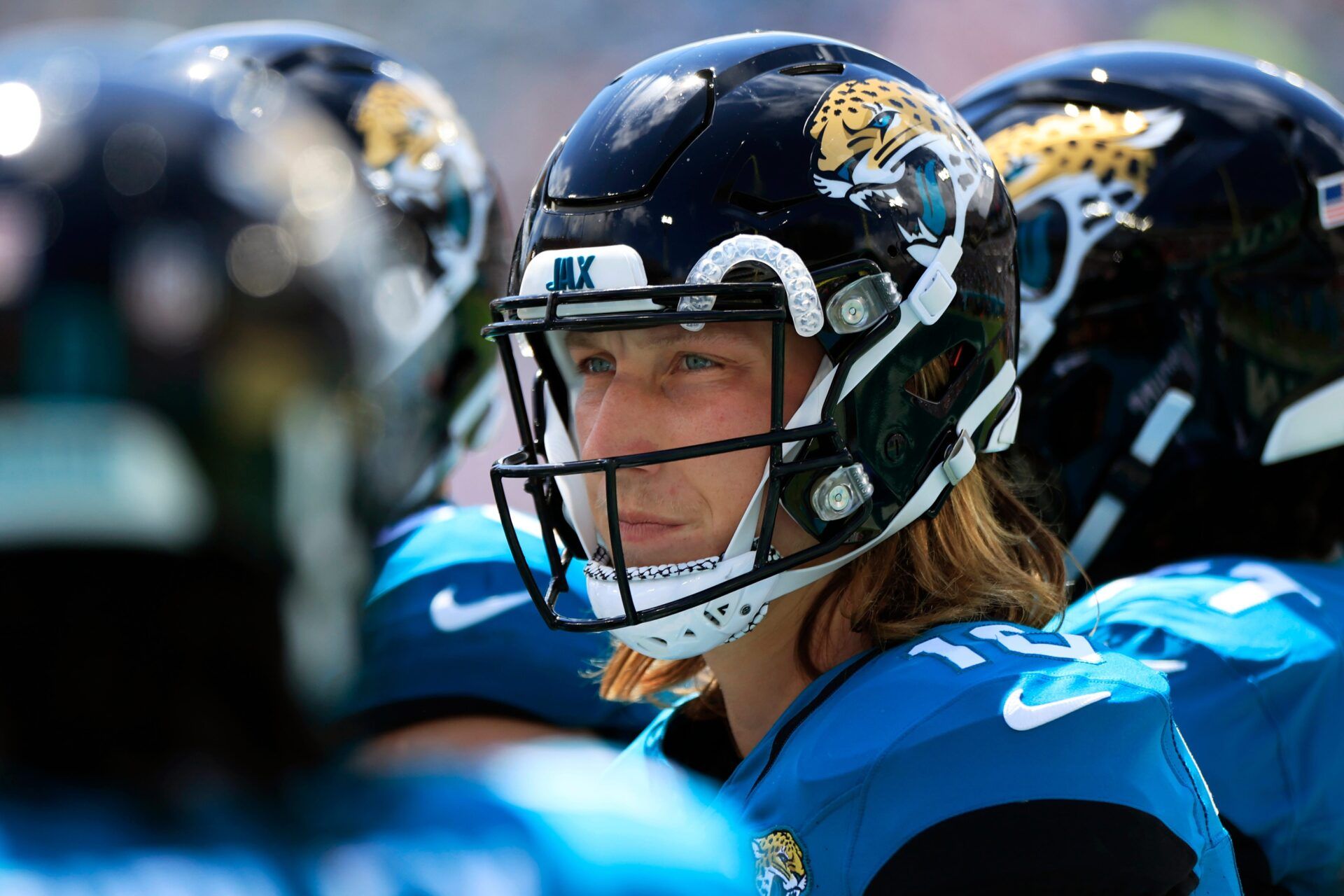Trevor Lawrence (16) looks on in a huddle during a time out during the first quarter.