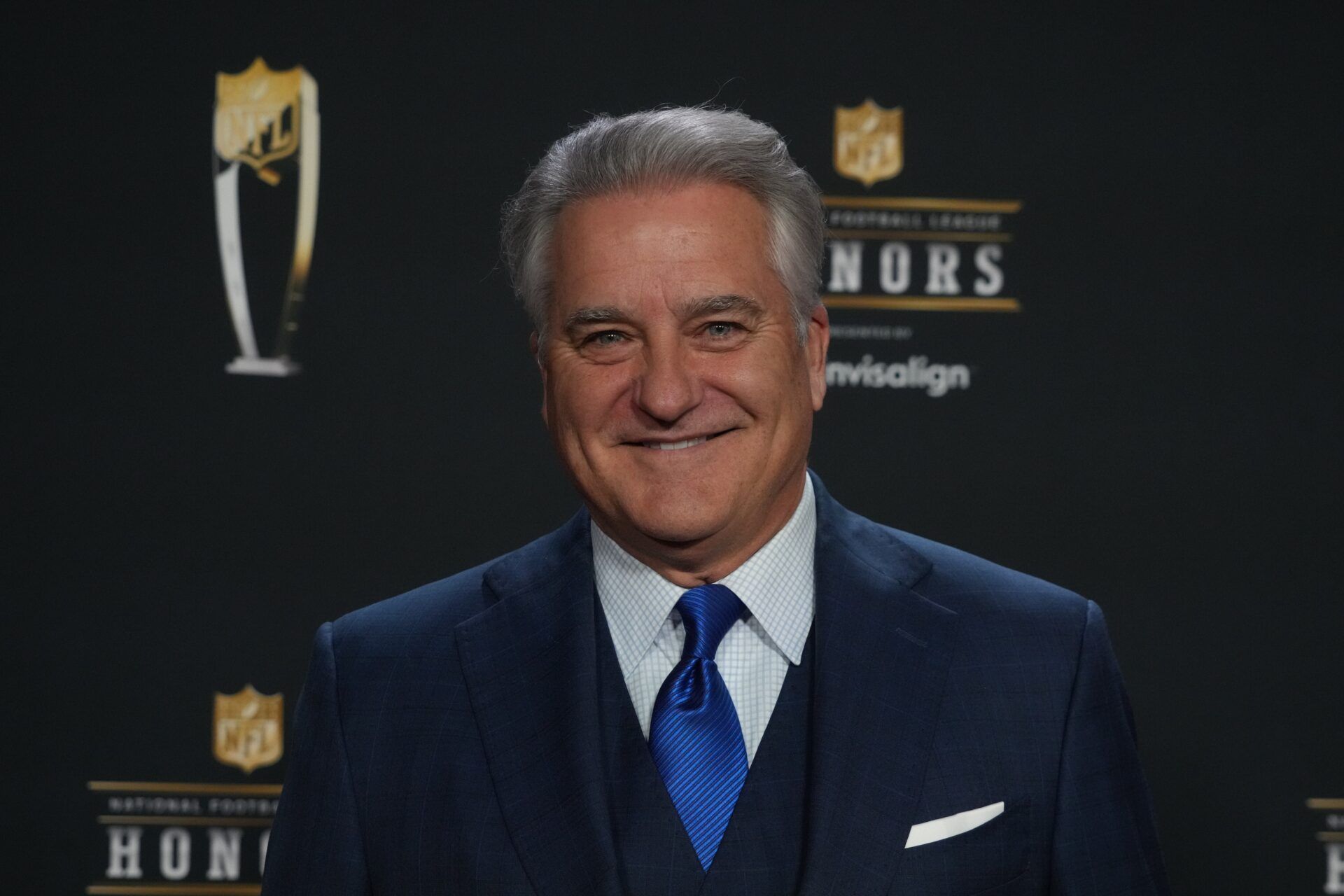 Former NFL coach Steve Mariucci poses for a photo on the red carpet before the NFL Honors award show at Symphony Hall.