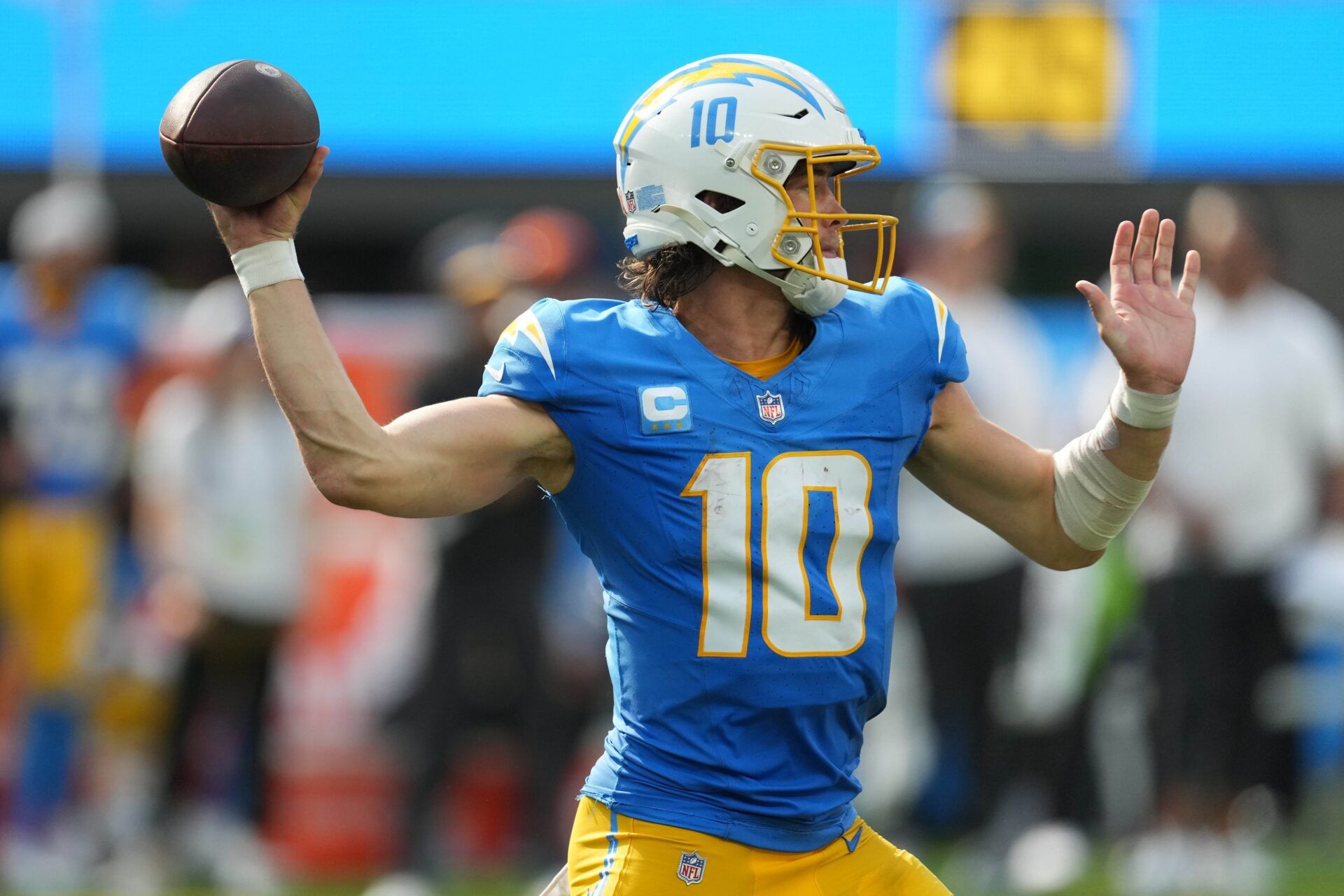 Justin Herbert (10) throws the ball against the Miami Dolphins in the second half at SoFi Stadium.