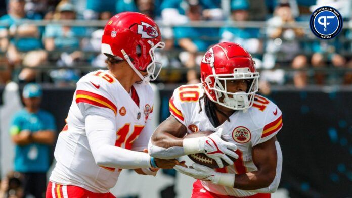 Kansas City Chiefs quarterback Patrick Mahomes (15) hands the ball off to running back Isiah Pacheco (10) against the Jacksonville Jaguars during the first quarter at EverBank Stadium.