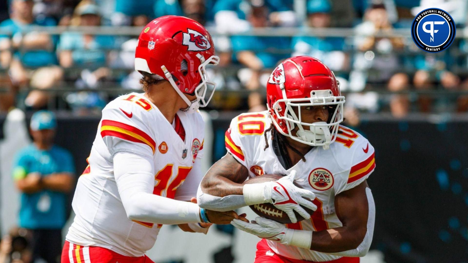 Kansas City Chiefs quarterback Patrick Mahomes (15) hands the ball off to running back Isiah Pacheco (10) against the Jacksonville Jaguars during the first quarter at EverBank Stadium.