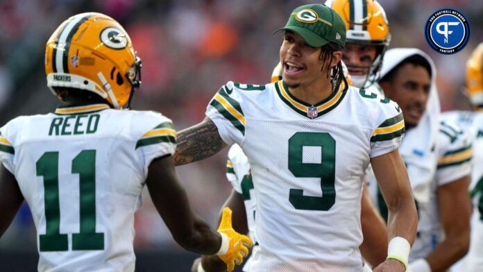 Green Bay Packers wide receiver Christian Watson (9) congratulates teammates coming off the field during a Week 1 NFL preseason game between the Green Bay Packers and the Cincinnati Bengals, Friday, Aug. 11, 2023, at Paycor Stadium in Cincinnati.