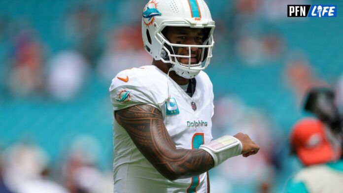 Miami Dolphins QB Tua Tagovailoa (1) warms up before playing the Denver Broncos.