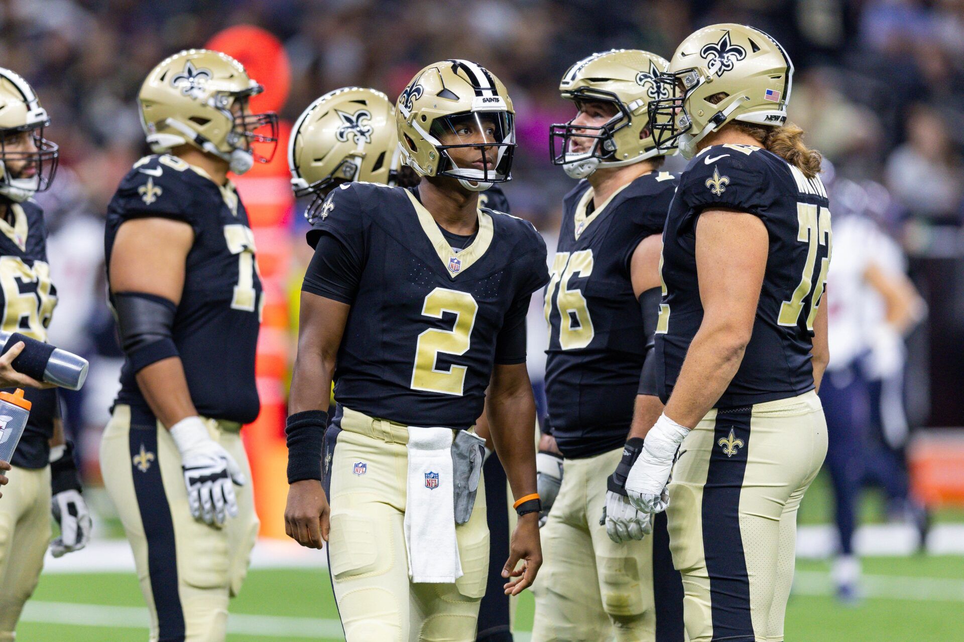 New Orleans Saints QB Jameis Winston (2) in the huddle with his teammates.