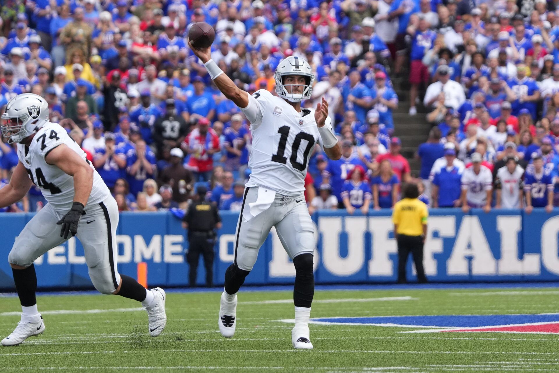 Las Vegas Raiders QB Jimmy Garoppolo (10) throws a pass deep against the Buffalo Bills.