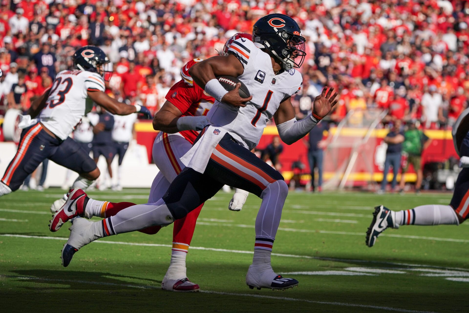 Sep 24, 2023; Kansas City, Missouri, USA; Chicago Bears quarterback Justin Fields (1) runs the ball against the Kansas City Chiefs during the first half at GEHA Field at Arrowhead Stadium. Mandatory Credit: Denny Medley-USA TODAY Sports