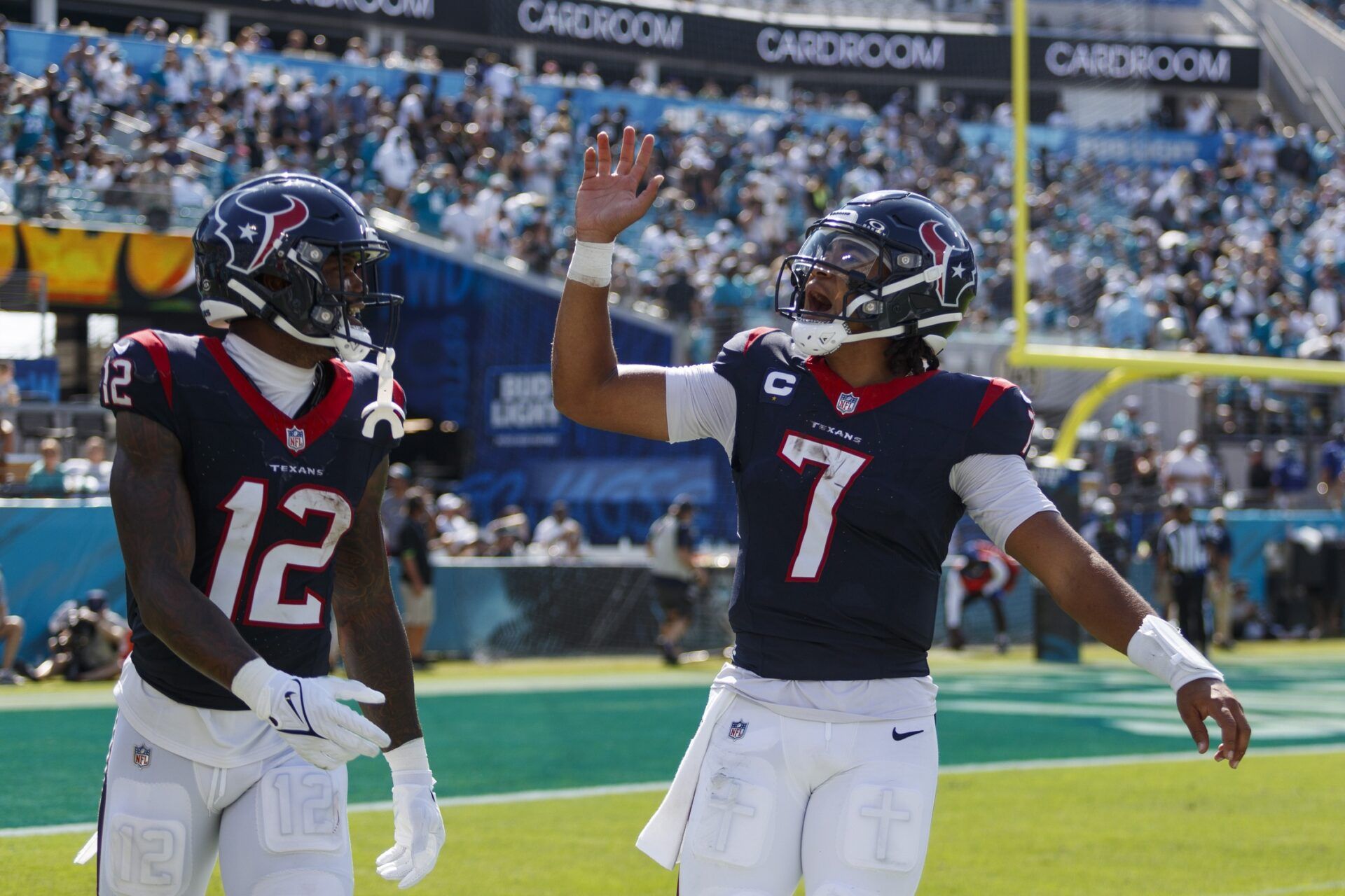 C.J. Stroud (7) and wide receiver Nico Collins (12) celebrate after a touchdown against Jacksonville Jaguars during the fourth quarter at EverBank Stadium.