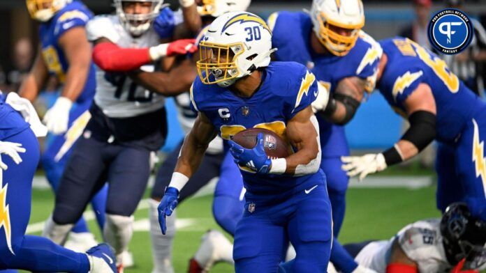 Austin Ekeler (30) carries the ball during the first quarter against the Tennessee Titans at SoFi Stadium.