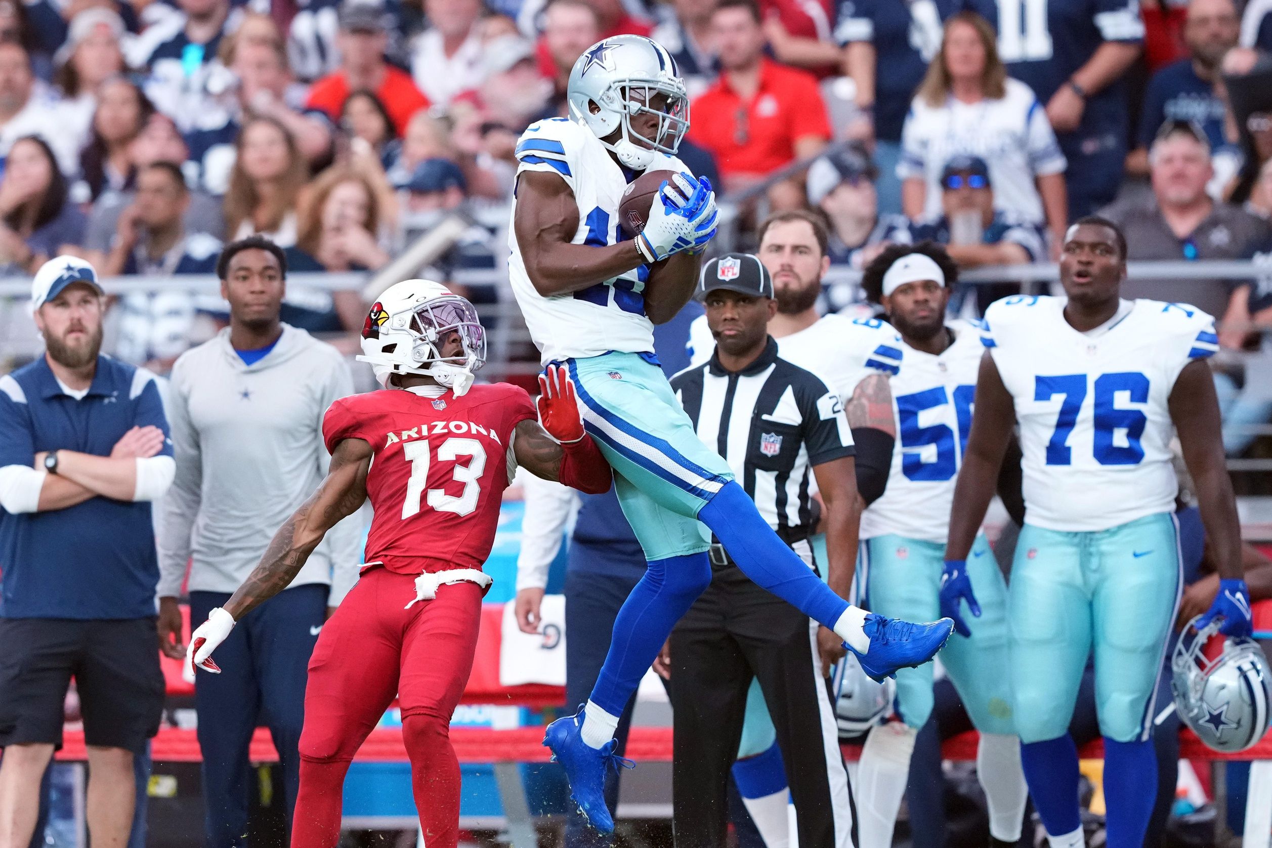 Michael Gallup (13) makes a catch over Arizona Cardinals cornerback Kei'Trel Clark (13) during the second half at State Farm Stadium.