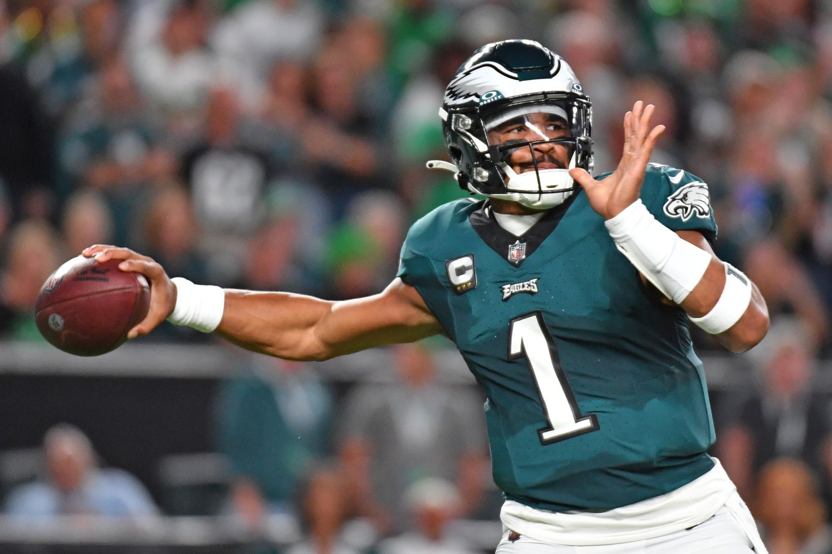 Jalen Hurts (1) throws a pitch against the Minnesota Vikings during the first quarter at Lincoln Financial Field.