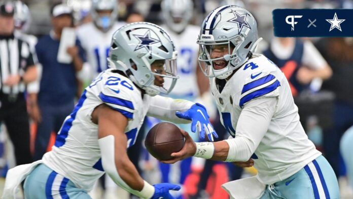 Dak Prescott (4) hands off to running back Tony Pollard (20) in the first half against the Arizona Cardinals at State Farm Stadium.