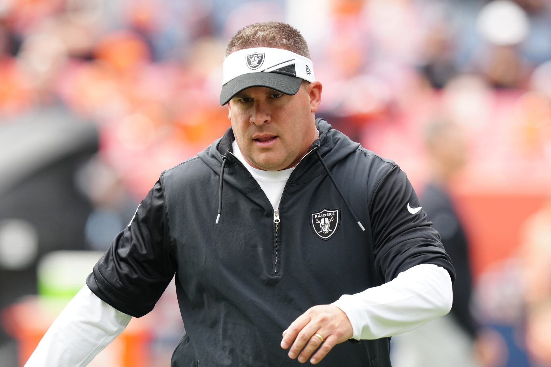 Josh McDaniels before the game against the Denver Broncos at Empower Field at Mile High.