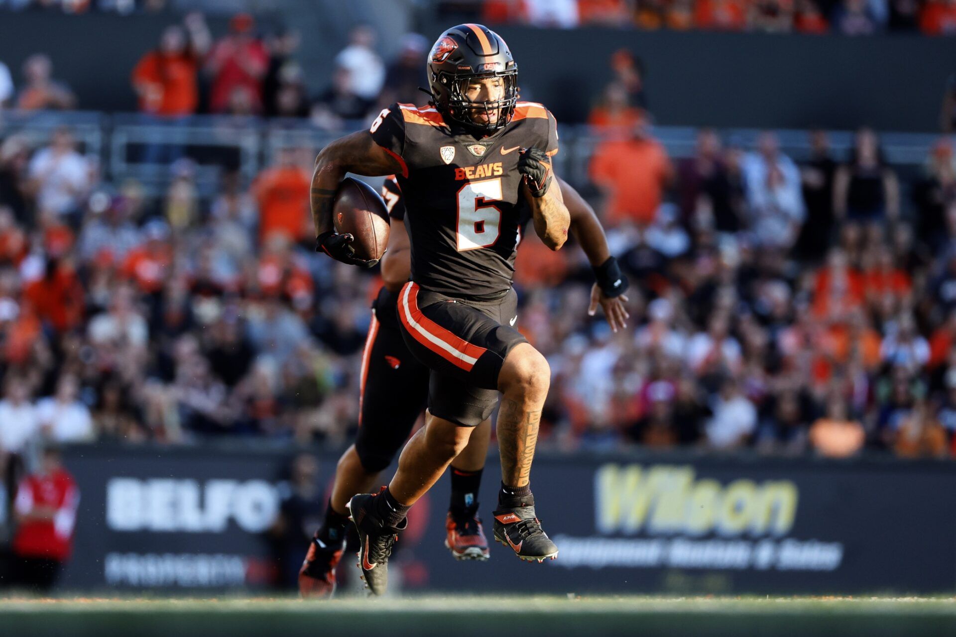 Damien Martinez (6) runs with the ball for a touchdown during the first half against the UC Davis Aggies at Reser Stadium.