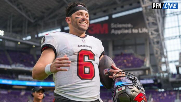 Tampa Bay Buccaneers QB Baker Mayfield (6) smiles coming off of the field.