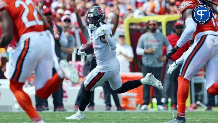 Rachaad White (1) runs with the ball against the Chicago Bears during the second half at Raymond James Stadium.