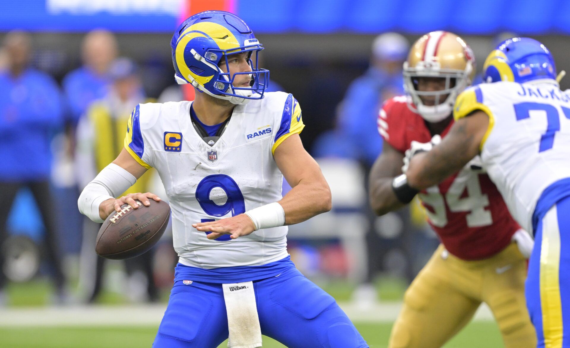 Los Angeles Rams QB Matthew Stafford (9) gets set to pass against the San Francisco 49ers.