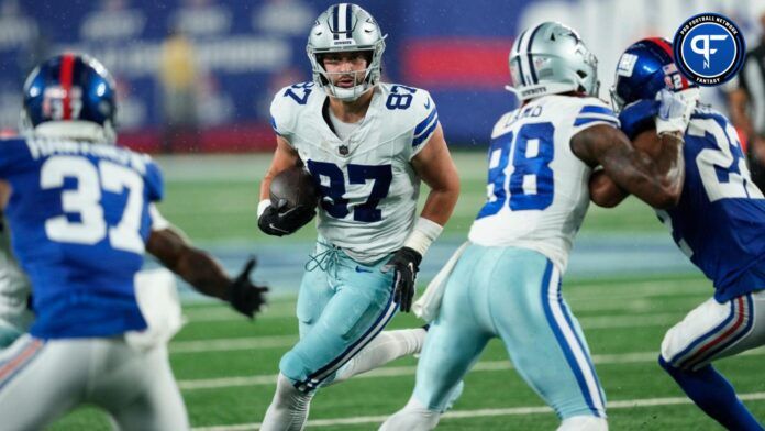 Jake Ferguson (87), runs with the ball against the New York Giants.