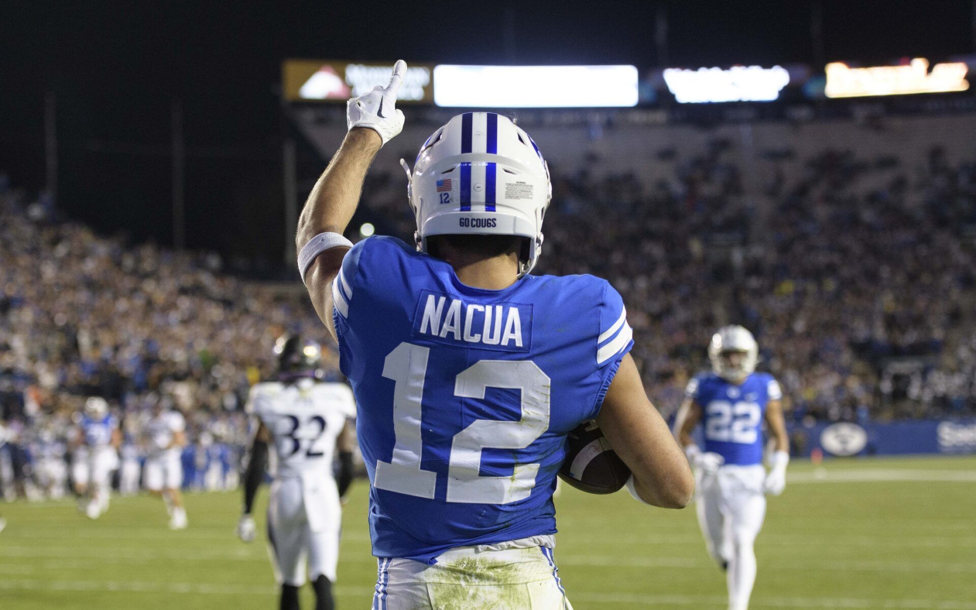 Puka Nacua (12) celebrates after scoring a touchdown during the second quarter against the East Carolina Pirates at LaVell Edwards Stadium.