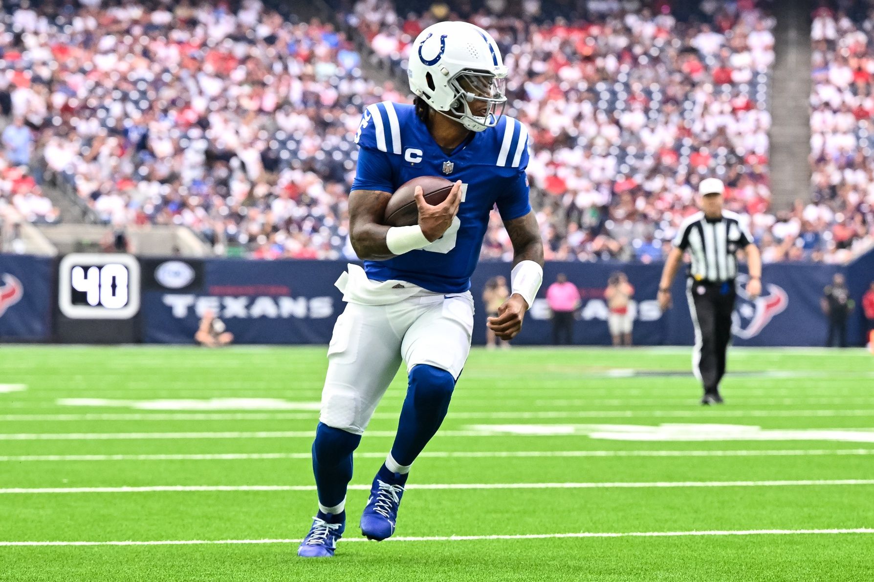 Anthony Richardson (5) runs the ball against the Houston Texans at NRG Stadium.