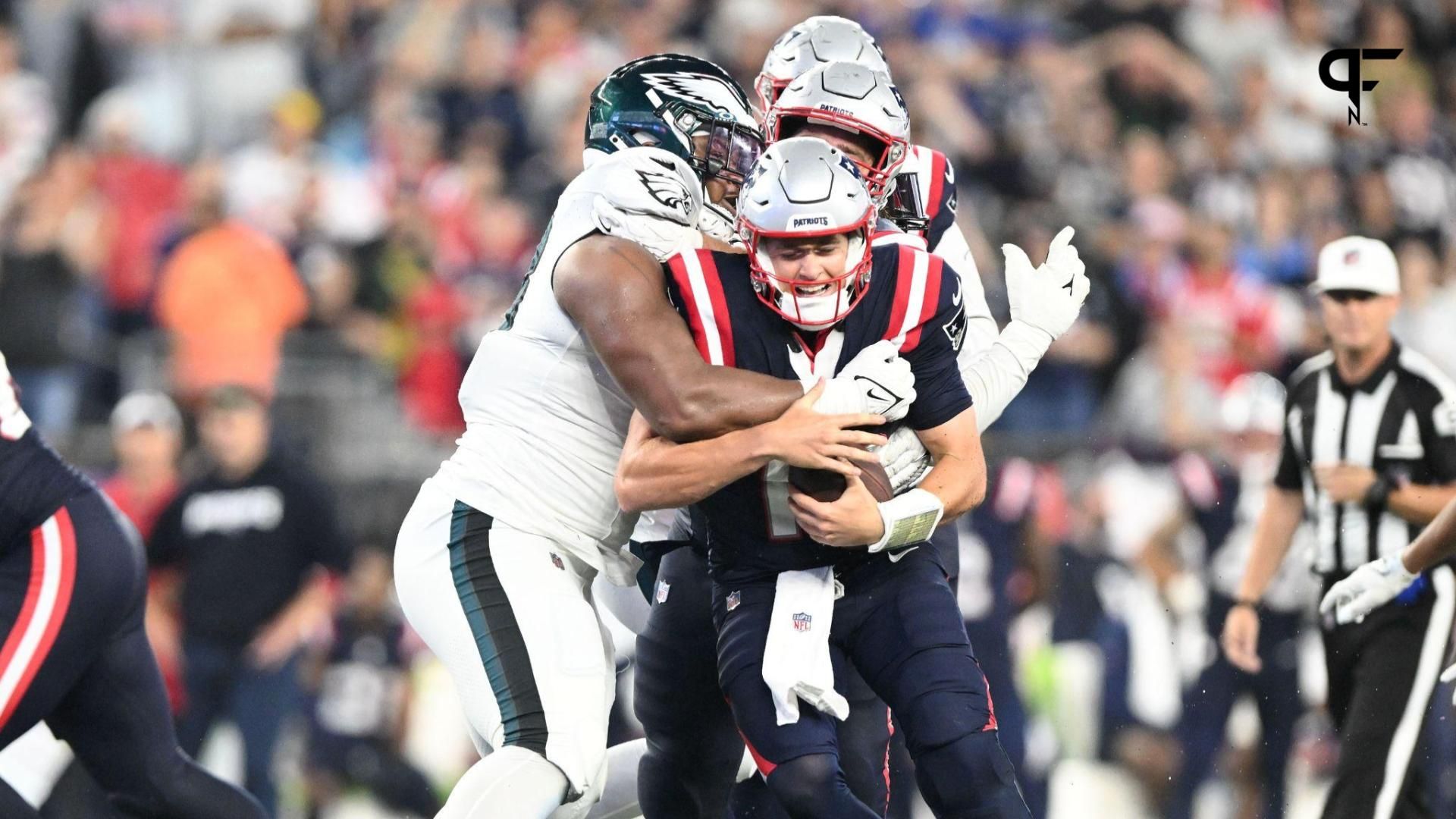 New England Patriots quarterback Mac Jones (10) is tackled by Philadelphia Eagles defensive tackle Jalen Carter (98) during the second half at Gillette Stadium.