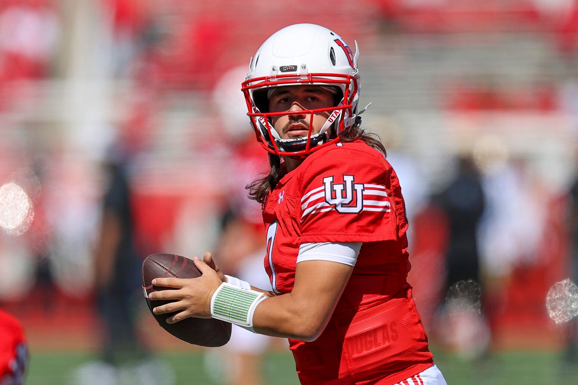 Utah Utes quarterback Cameron Rising (7) warms up before a game against the UCLA Bruins at Rice-Eccles Stadium.