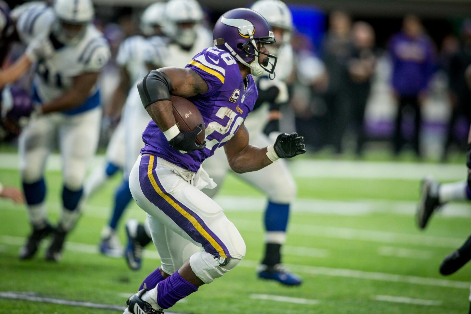 Minnesota Vikings running back Adrian Peterson (28) rushes against the Indianapolis Colts in the third quarter at U.S. Bank Stadium.