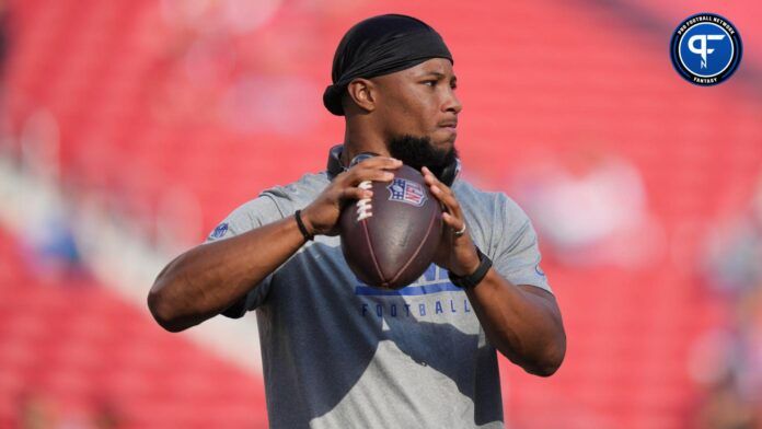 New York Giants RB Saquon Barkley throws the ball before a game.