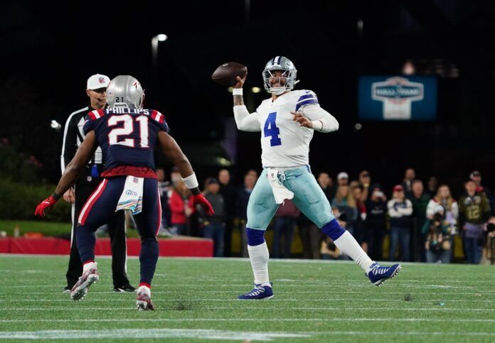 Dallas Cowboys QB Dak Prescott (4) throws a TD pass against the New England Patriots.