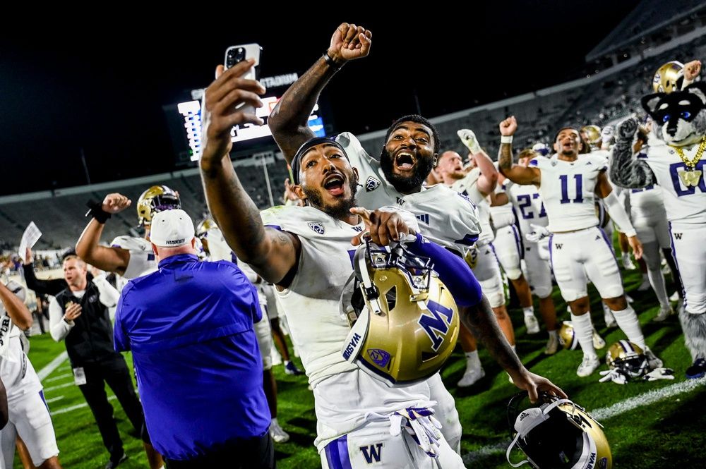 Ja'Lynn Polk, left, and Devin Culp celebrate after beating Michigan State.