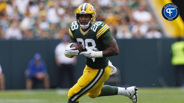 AJ Dillon (28) rushes with the football during the second quarter against the New Orleans Saints at Lambeau Field.