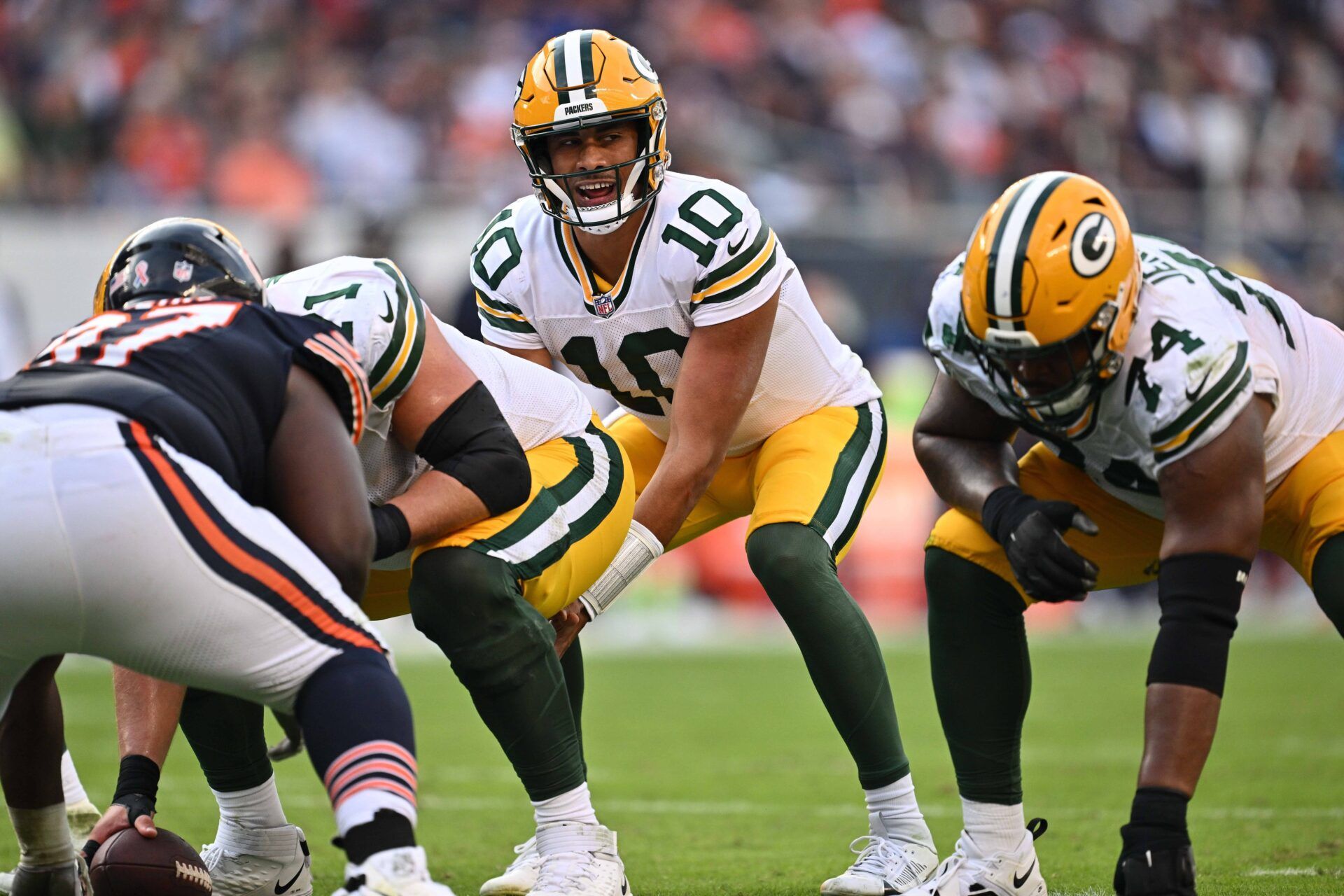 Jordan Love (10) calls signals against the Chicago Bears at Soldier Field.