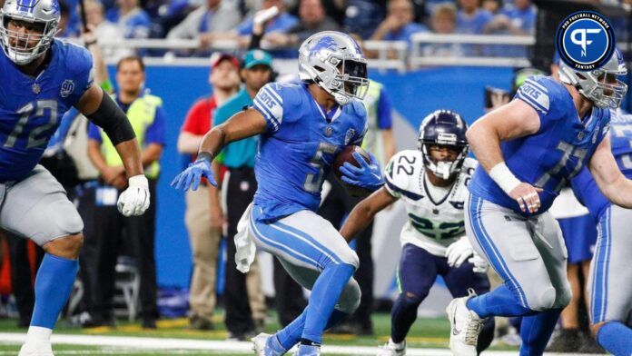 David Montgomery (5) runs against Seattle Seahawks during the second half at Ford Field in Detroit.