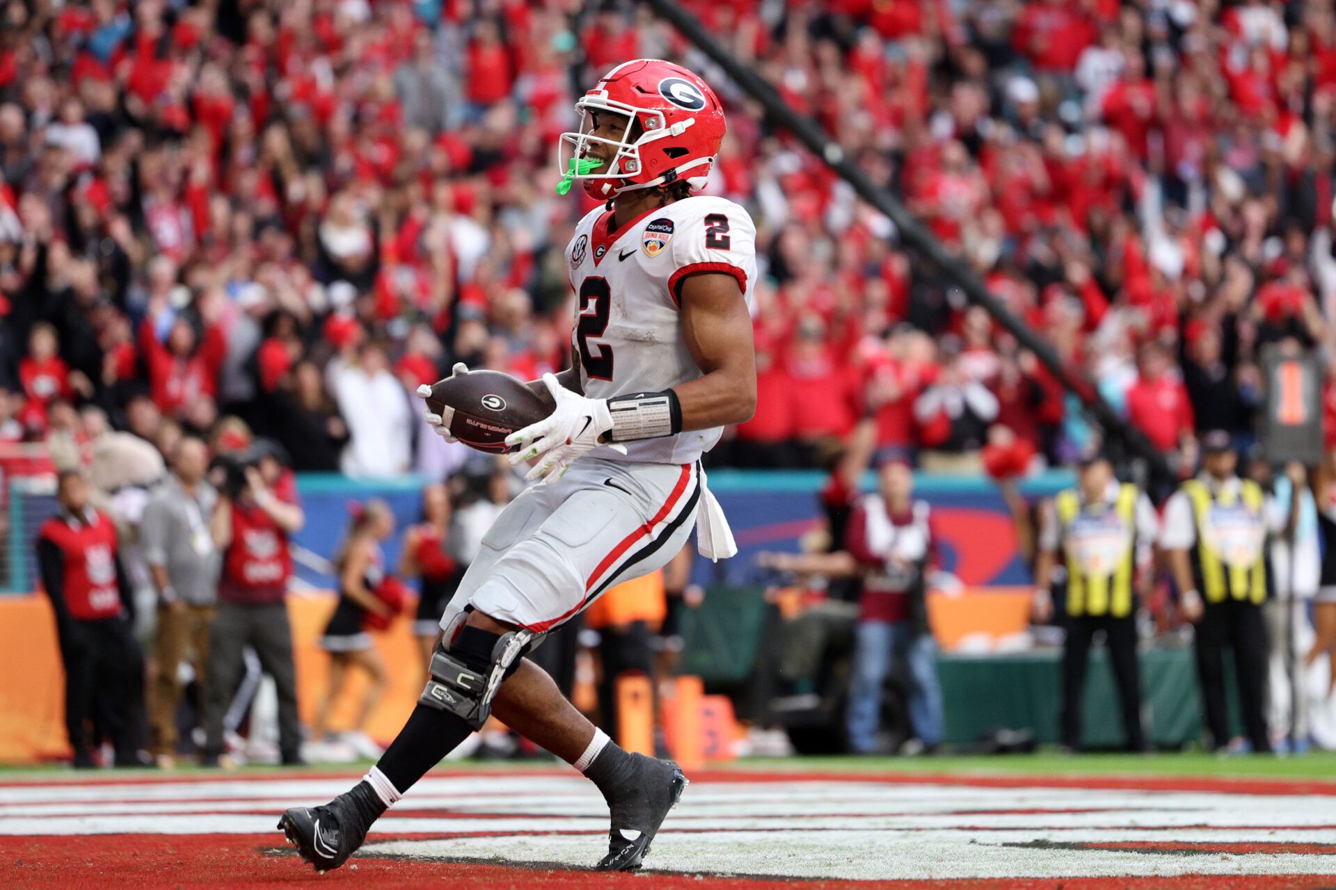 Georgia Bulldogs running back Kendall Milton (2) reacts after scoring a touchdown against the Florida State Seminoles during the first half in the 2023 Orange Bowl at Hard Rock Stadium.