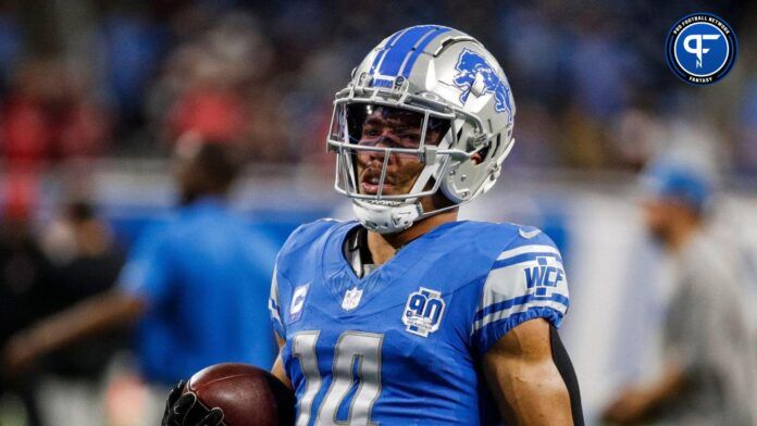 Detroit Lions wide receiver Amon-Ra St. Brown (14) warms up before the Atlanta Falcons game at Ford Field in Detroit on Sunday, Sept. 24, 2023.