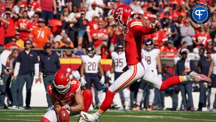 Kansas City Chiefs place kicker Harrison Butker (7) kicks the point after touchdown against the Chicago Bears during the first half at GEHA Field at Arrowhead Stadium.