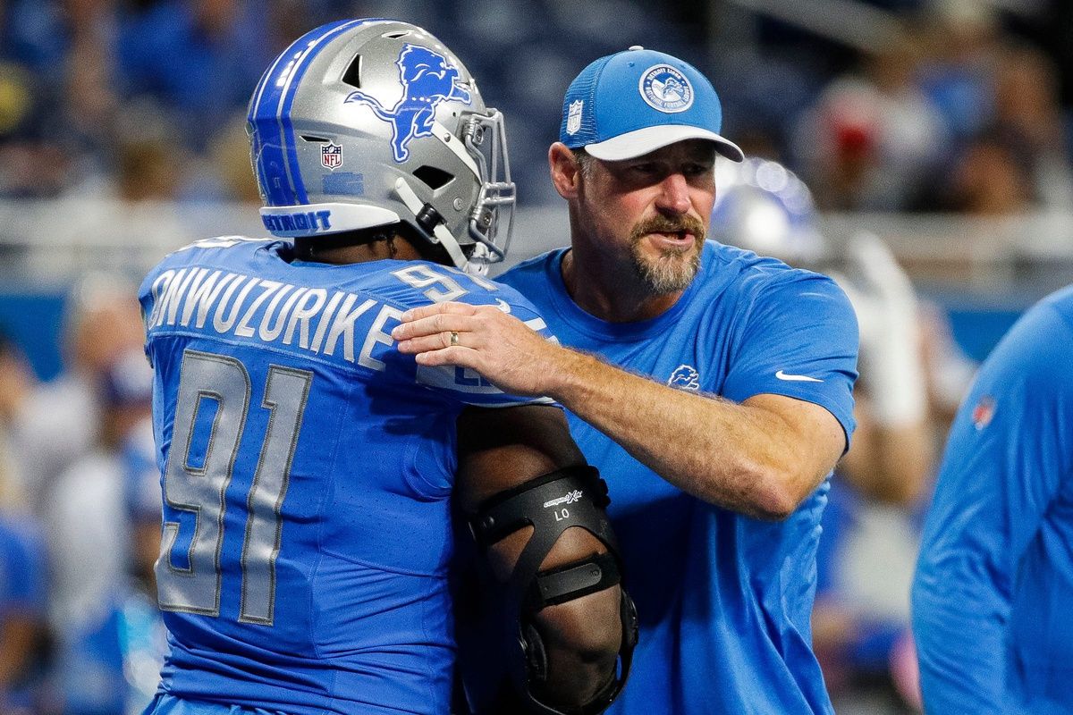 Dan Campbell hugs defensive end Levi Onwuzurike before the Atlanta Falcons game at Ford Field.