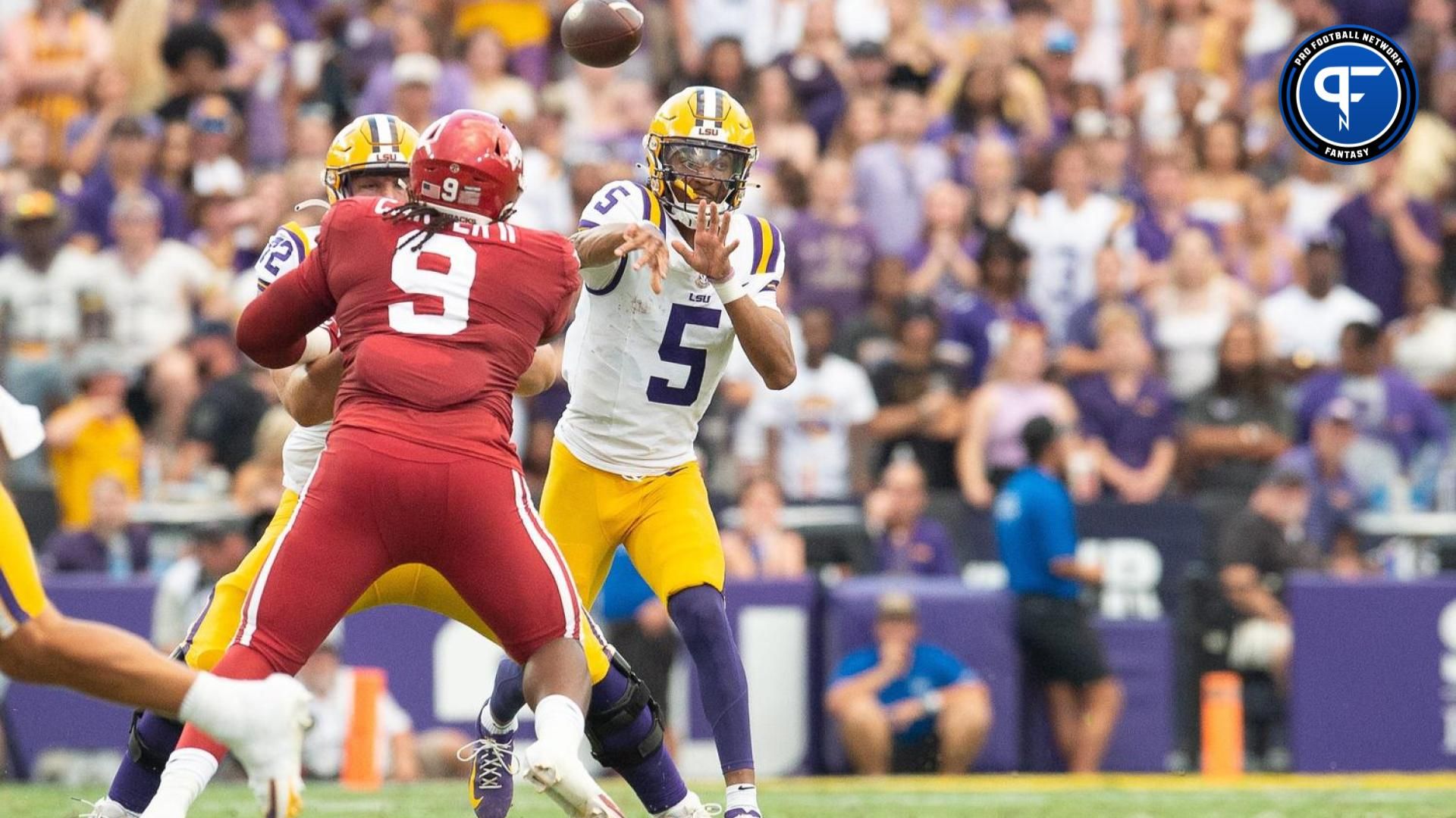 LSU Quarterback Jayden Daniels throws a pass against Arkansas.