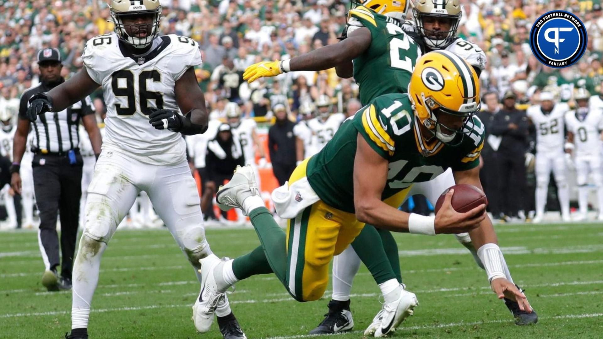 Green Bay Packers quarterback Jordan Love scores a rushing touchdown against the New Orleans Saints.