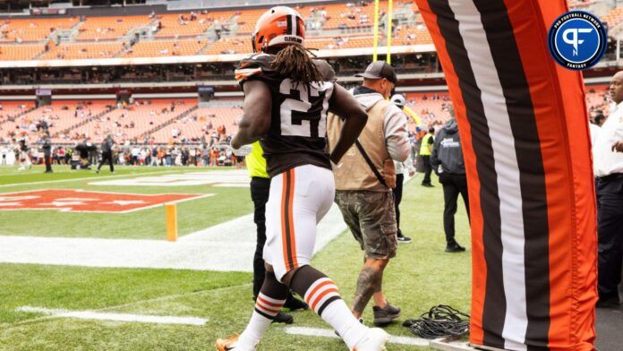 Cleveland Browns running back Kareem Hunt (27) runs onto the field for warmups before the game against the Tennessee Titans at Cleveland Browns Stadium.