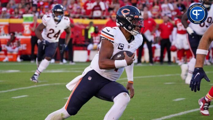 Chicago Bears quarterback Justin Fields (1) runs the ball against the Kansas City Chiefs during the second half at GEHA Field at Arrowhead Stadium.