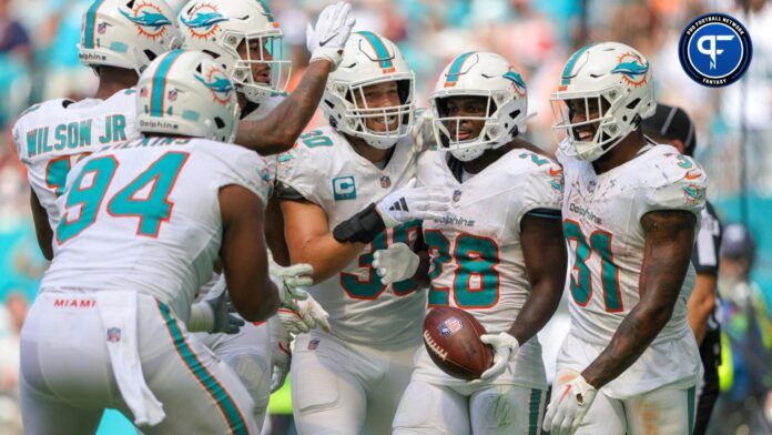 De'Von Achane (28) celebrates his touchdown with Miami Dolphins running back Raheem Mostert (31) against the Denver Broncos in the fourth quarter at Hard Rock Stadium.