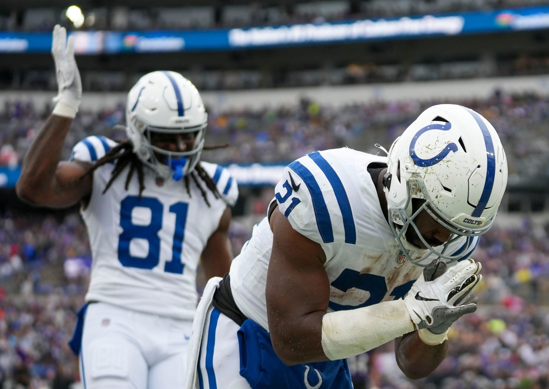 Zack Moss (21) takes a bow after scoring a second quarter touchdown.