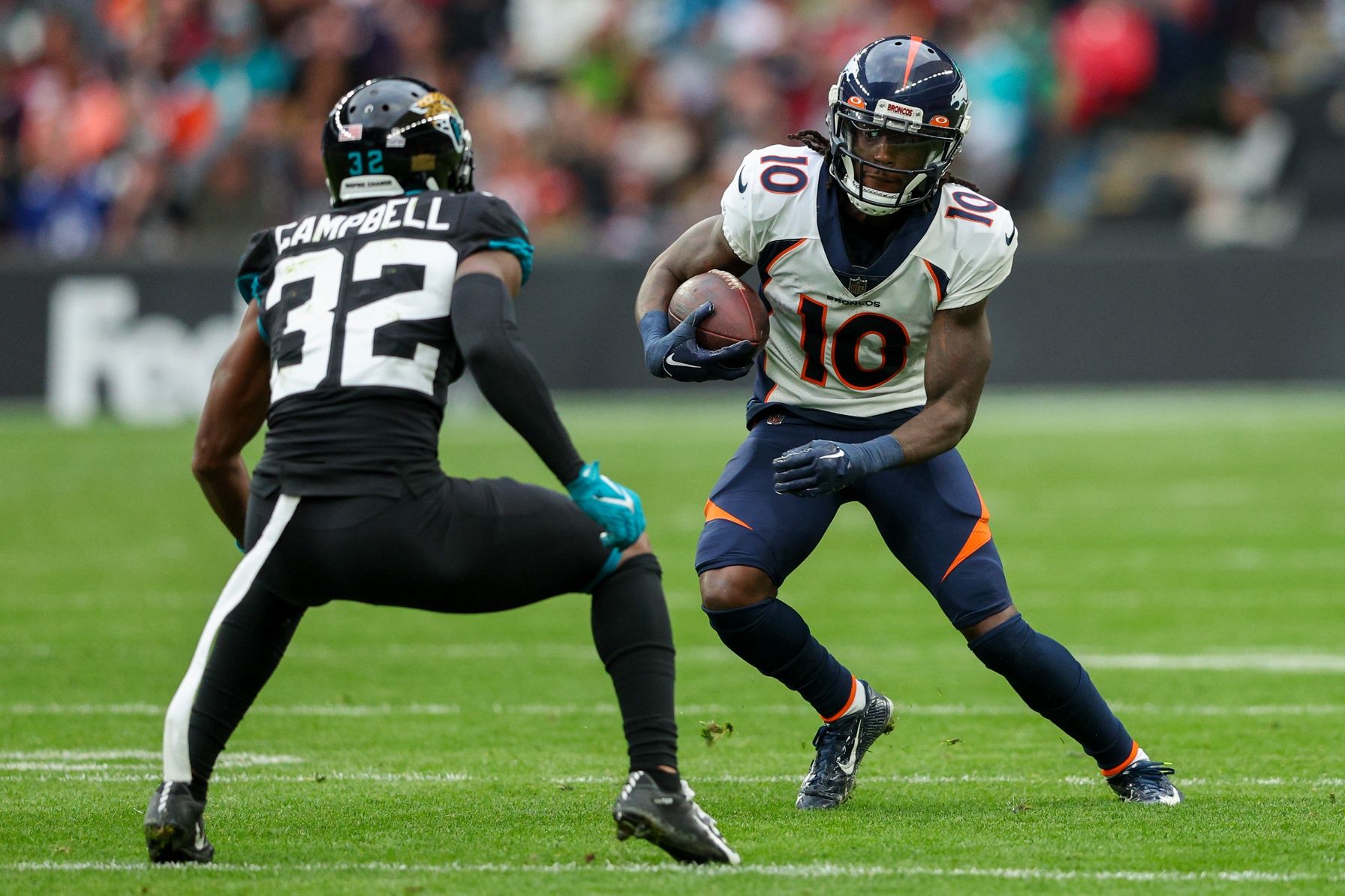 Jacksonville Jaguars cornerback Tyson Campbell approaches Denver Broncos receiver Jerry Jeudy in a game played in England.