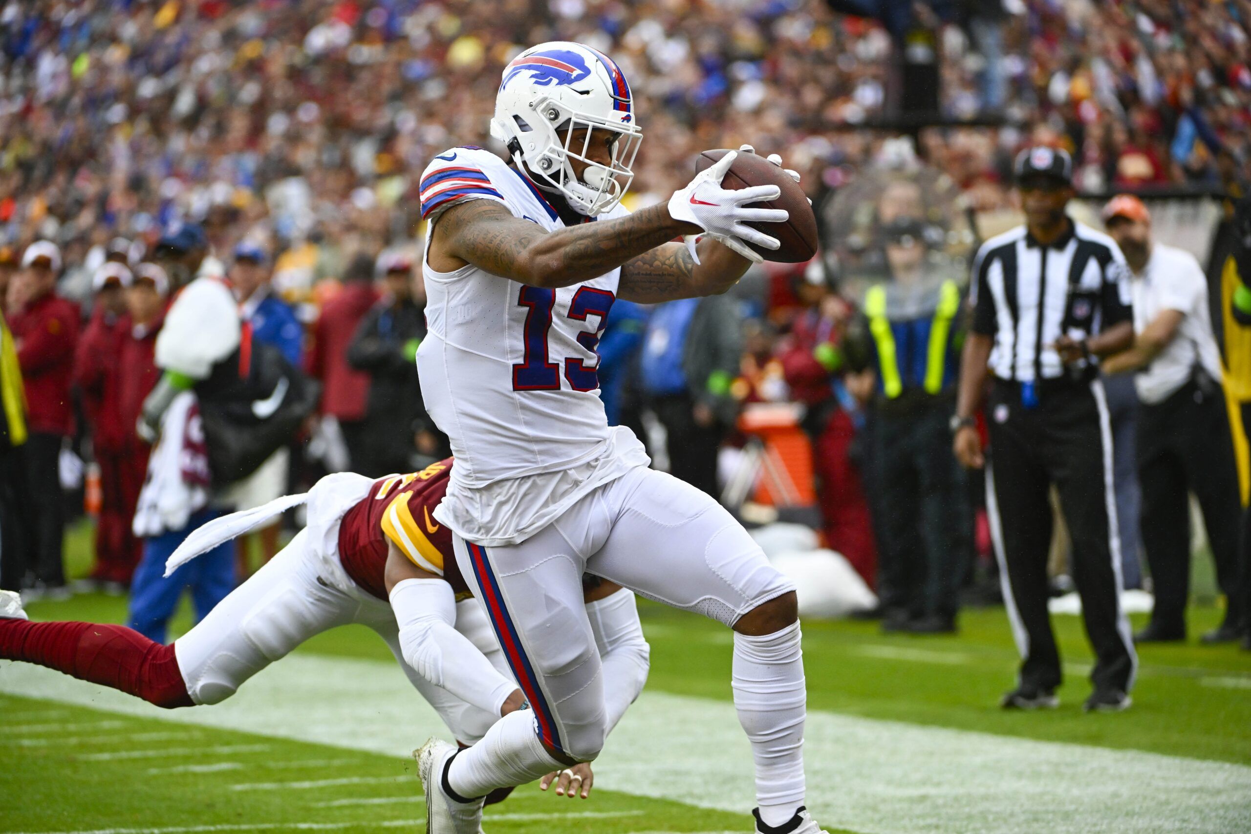 Gabe Davis (13) scores a touchdown against the Washington Commanders during the first half at FedExField.