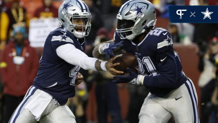 Dallas Cowboys quarterback Dak Prescott (4) hands the ball off to Cowboys running back Ezekiel Elliott (21) against the Washington Commanders at FedExField.